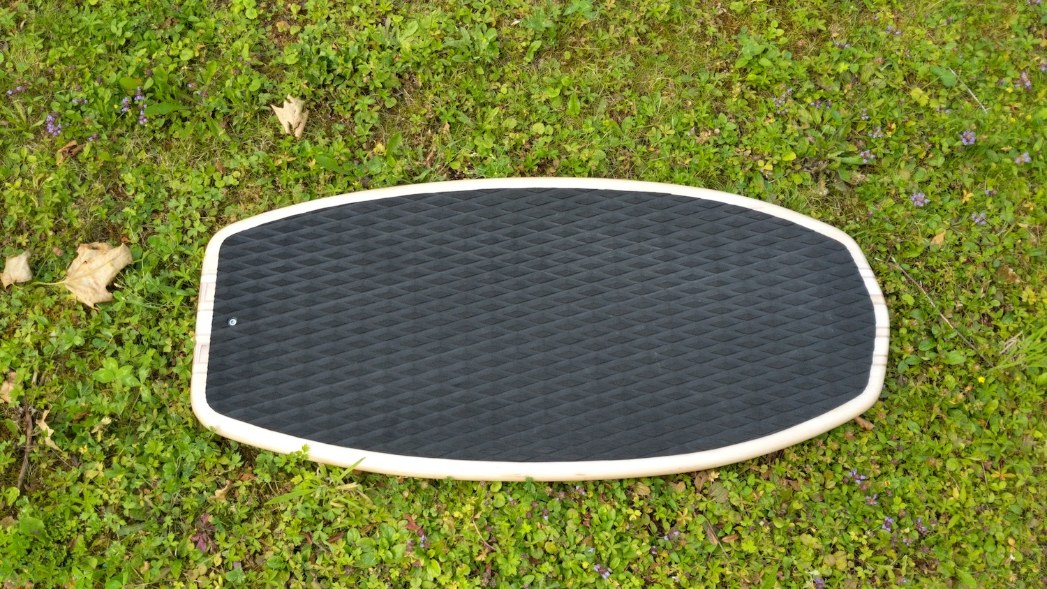 Finished Balsa Skate Foil Board in grass