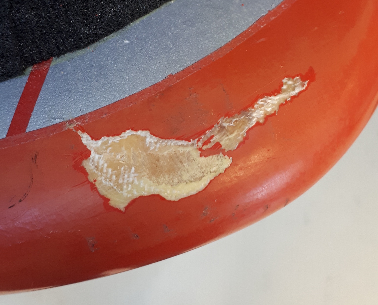 Splintered paint around the impact point